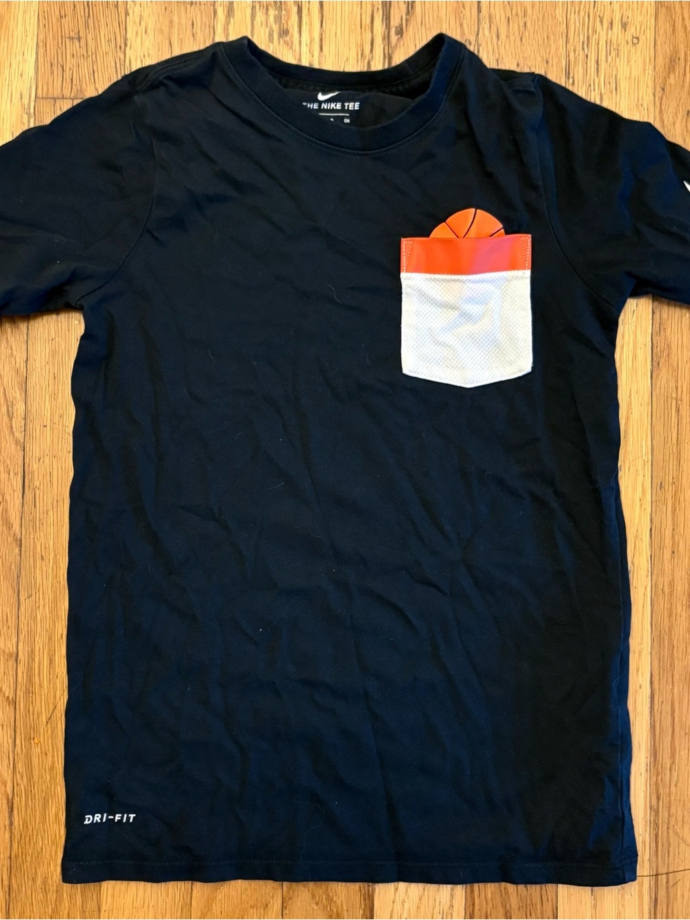 Nike boy’s  Black  Dri-FIT Tee with White Mesh Pocket and Orange Trim